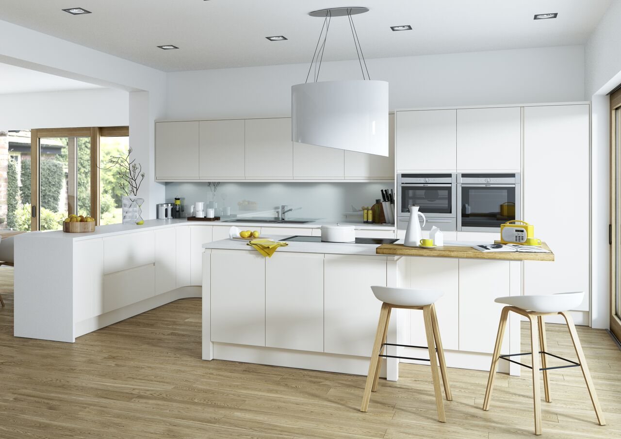 A white handleless kitchen with a long island and pendant lighting